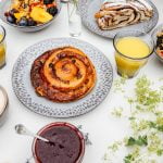 pastries and fruit on plates with flowers