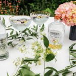 Fever tree tonic and conker gin on white tablecloth