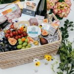 cheese grapes and wine in hamper