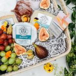 cheese grapes and wine in hamper