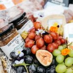 cheese grapes and wine in hamper