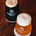 two beers in glass on table